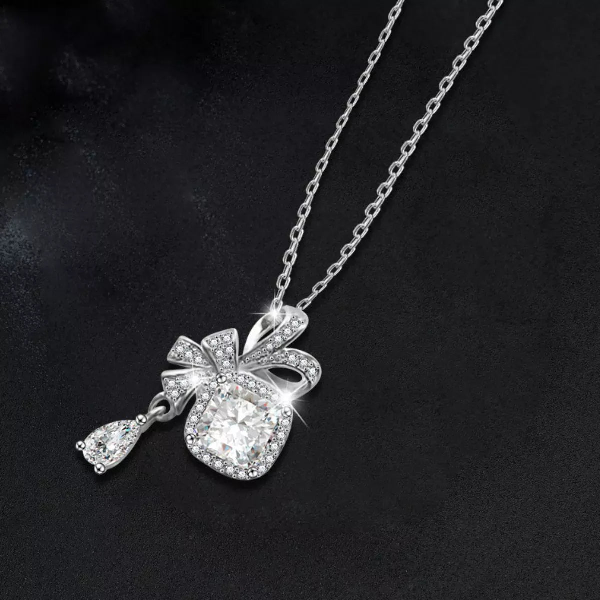 1.5 Carat Moissanite 925 Sterling Silver Bowknot Pendant Necklace Silver / One Size The Nichole Collection