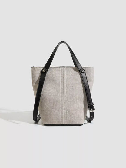 CANVAS CONTRAST-STRAP BUCKET TOTE The Nichole Collection - Official Site