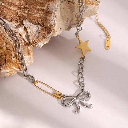 Two-Tone Bow Star Necklace Silver / One Size The Nichole Collection