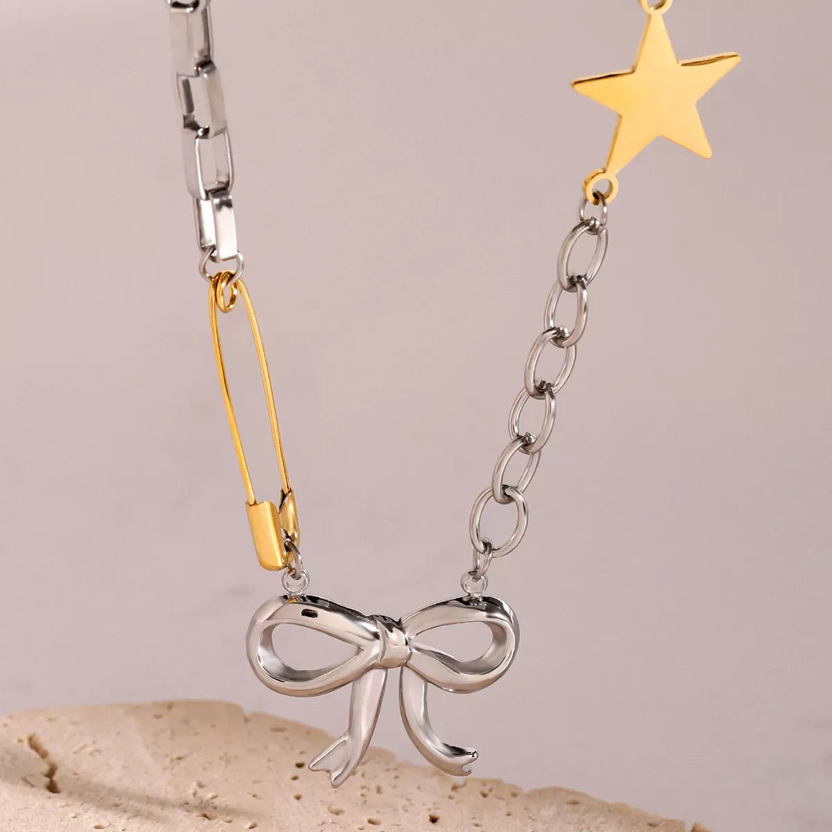Two-Tone Bow Star Necklace Silver / One Size The Nichole Collection